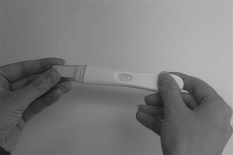 A Female Getting A Positive Pregnancy Result On An At Home Pregnancy Test After Ivf Treatment