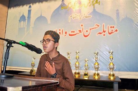 A Boy Reciting Naat During Azan And Naat Competition Organized By Anjam