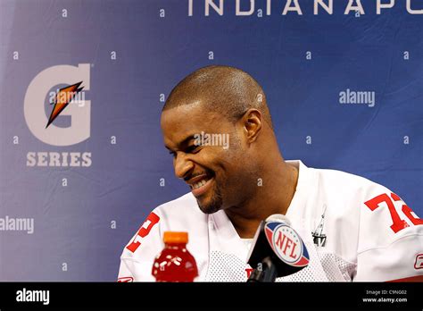 New York's Osi Umenyiora (72) answers questions during the Super Bowl XLVI media day in Lucas ...