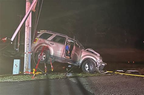 Vehicle Caught In Power Lines After Crashing Into Utility Pole