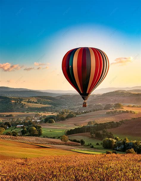 Hot Air Balloon Over Fields Background Wallpaper Image For Free