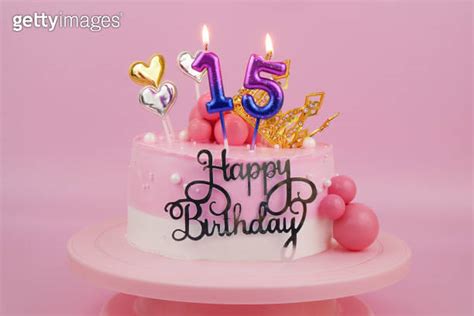 Pink Birthday Cake With Gold Crown And Burning Candles Number