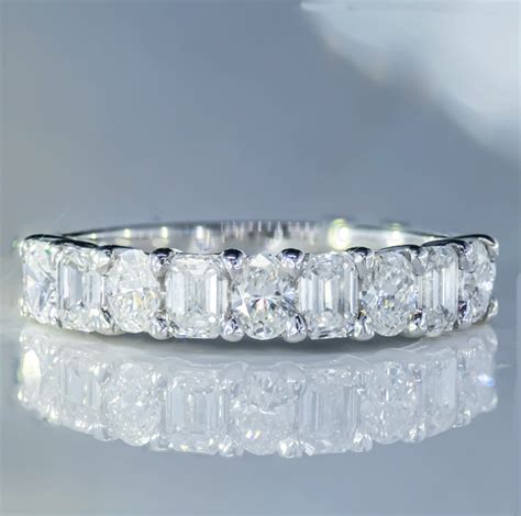 18k White Gold Band With 1 11ctw Of Oval And Emerald Cut Diamonds