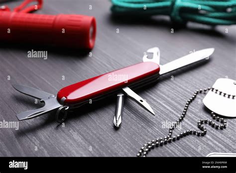 Modern Compact Portable Multitool And Accessories On Wooden Table Stock