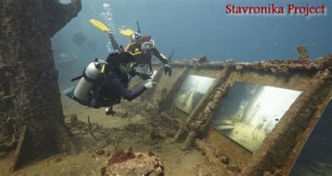 A Scuba Diver Swims Over The Bottom Of An Old Ship