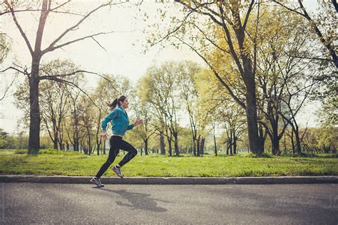 "Woman Jogging In The Park" by Stocksy Contributor "Lumina" - Stocksy