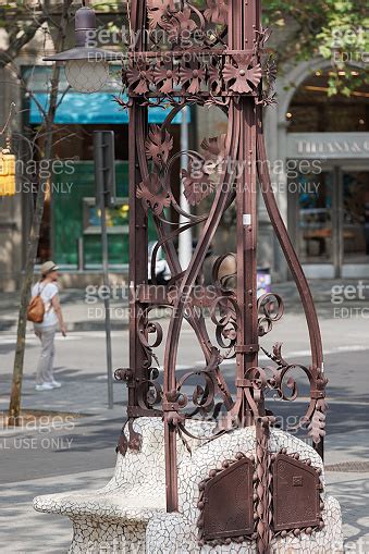 Public Bench With Wrought Iron Ornament In Passeig De Gracia Street In