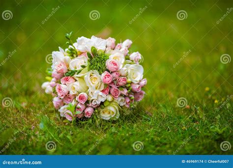 Wedding Bouquet on the Grass Stock Photo - Image of celebration, grass ...