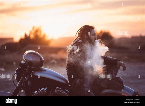 Man With Dreadlocks Sitting High Resolution Stock Photography And