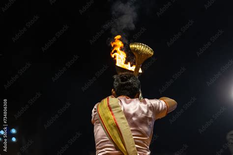 Ganga aarti, Portrait of young priest performing holy river ganges ...