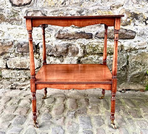 A Pair Of Edwardian Yew Wood Two Tier Side Tables