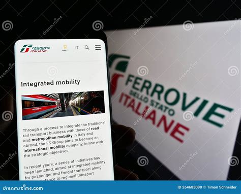 Person Holding Cellphone With Webpage Of Company Ferrovie Dello Stato