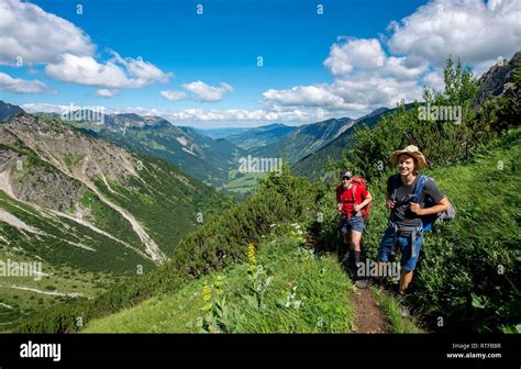 Two Hikers On Hiking Trail From Hinterstein To Schrecksee View Into