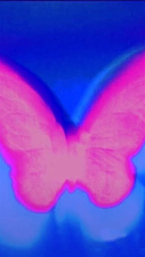 A Pink Butterfly Flying Through The Air