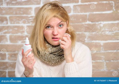 Nasal Spray Runny Nose Remedy. Girl Sick Person Hold Nasal Drops and Tissue. Allergy Concept ...