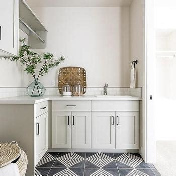 Peacock Blue Laundry Room Cabinets With Silver Tiles Transitional