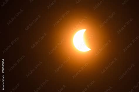 Partial solar eclipse Stock Photo | Adobe Stock