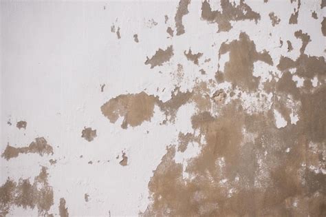 Antigo fundo de textura de parede de gesso escuro e branco áspero e