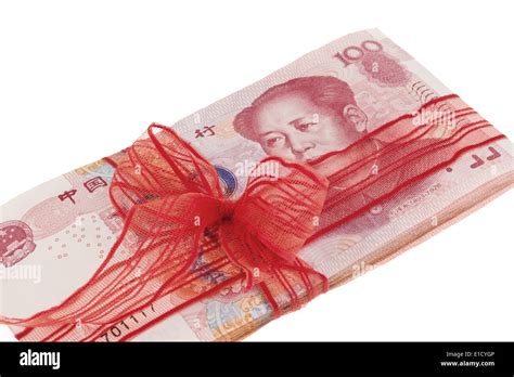 Chinese Yuan banknotes in a red ribbon Stock Photo - Alamy