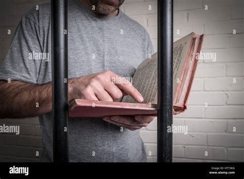 A Prisoner Reading In His Cell In Prison Photo Posed By Model To