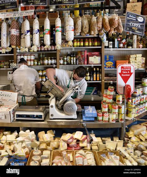 An Employee Makes Sandwiches At The Landmark Italian American Deli