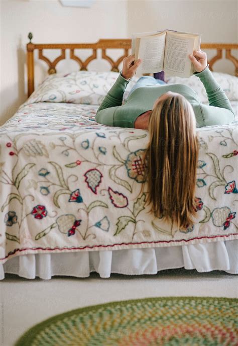 "Relax Woman Reading Book On Bed" by Stocksy Contributor "Raymond ...