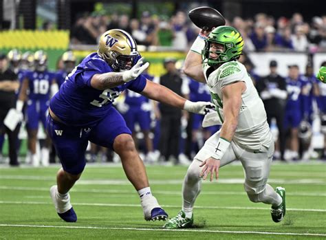 Oregon Quarterback Bo Nix Dejected After Loss In Pac 12 Championship