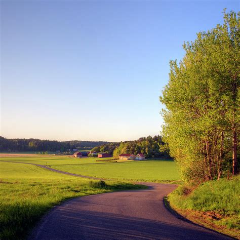 Road Through A Country Landscape In By Johan Klovsjö