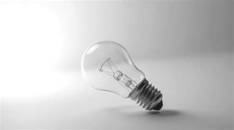 Premium Ai Image Glowing Glass Light Bulb On Grey Background