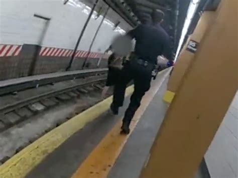 Video Woman Passes Out Falls Onto Subway Tracks Before Nypd Rescue