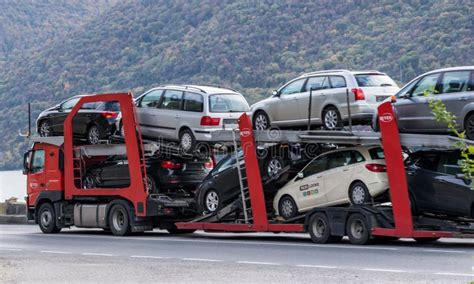 An Automotive Car Carrier Truck Driving Down the Highway with a Full ...