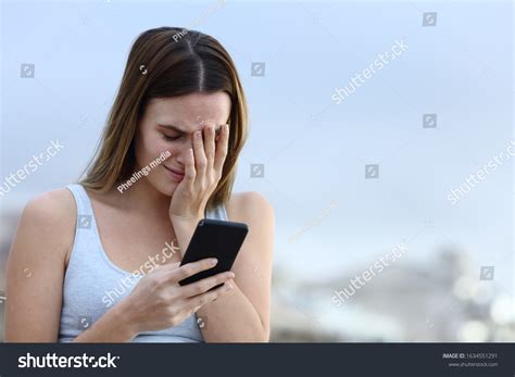 Sad Woman Crying Checking Bad News Stock Photo Edit Now 1634551291