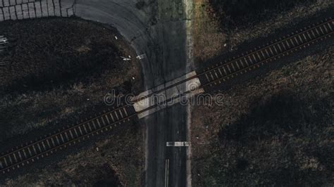 Drone Top-down View of the Road and Railways Crossing Point - Dark Mood Stock Image - Image of ...