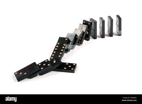 Stack Of Dominoes Falling On White Background Stock Photo Alamy