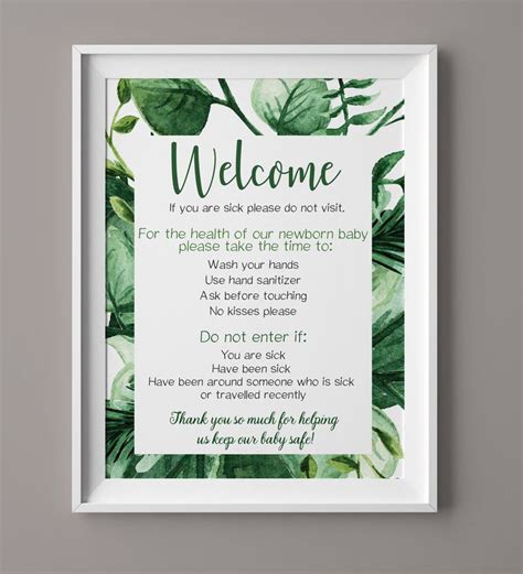 A White Framed Sign With Green Leaves On It That Sayswelcome To You