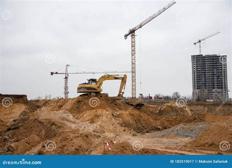 Excavator During Earthworks At Construction Site Backhoe Digging The