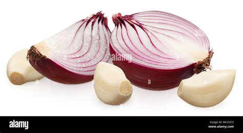 Half And Slice Of Fresh Unpeeled Red Onion And Three Peeled Cloves Of