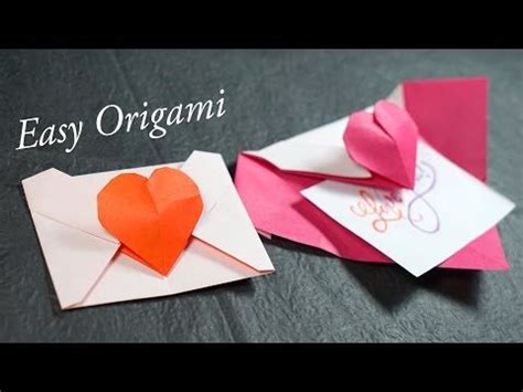 an origami heart and envelope with the words easy origami on it