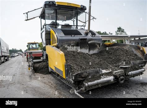 Asphalt Paver Machine During Road Construction And Repairing Works A