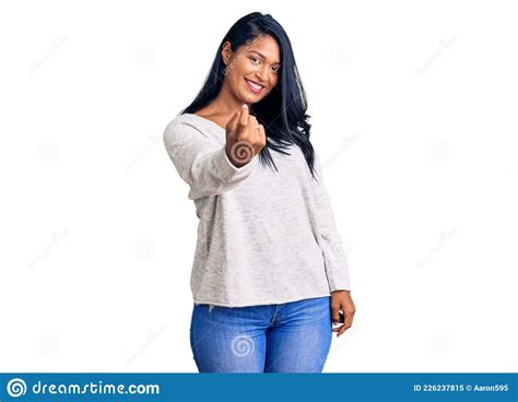 Hispanic Woman With Long Hair Wearing Casual Clothes Beckoning Come