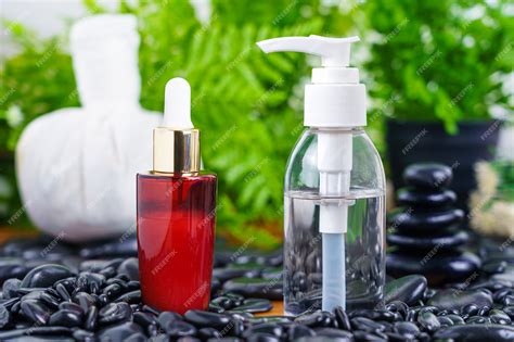 Premium Photo Thai Spa Massage Setting With Red Serum Oil Bottle Dropper Mock Up Or Essential