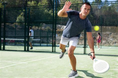 Male Players Playing Padel in a Padel Court Outdoor Behind Net Stock ...