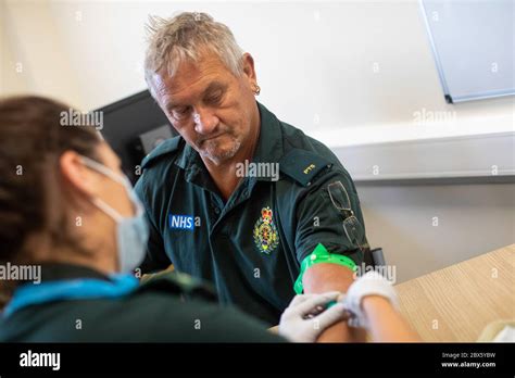 Paramedic Jess Baddams Left Takes A Blood Sample From Tony Oliver A