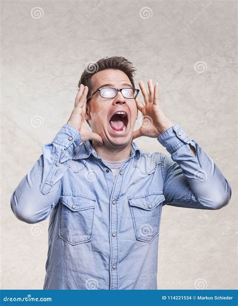 Portrait Of A Shocked Screaming Stunned Or Surprised Young Man Stock