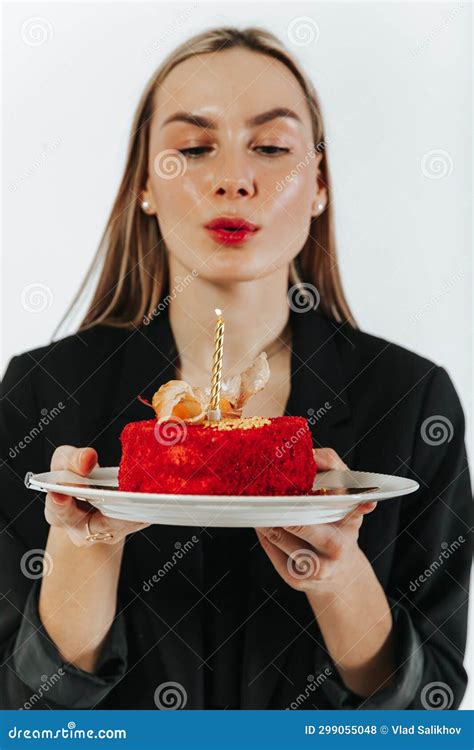 Blowing The Birthday Candles Attractive Young Woman Making A Wish