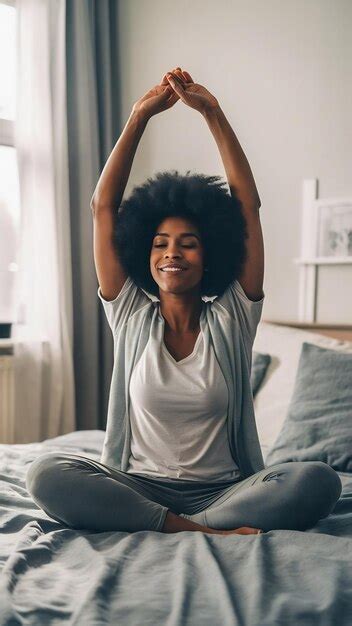 Black Woman Morning Stretching And Waking Up In Home Bedroom After