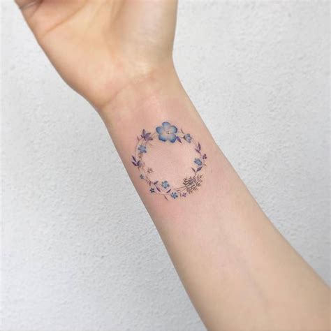 Flower wreath tattoo on the right inner wrist. | Wreath tattoo, Circle tattoos, Circular tattoo