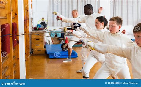 Group Practicing Fencing Techniques in Gym Stock Photo - Image of ...