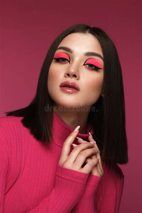 Beautiful Brunette Woman In Pink Clothes With Pink Fashion Make Up