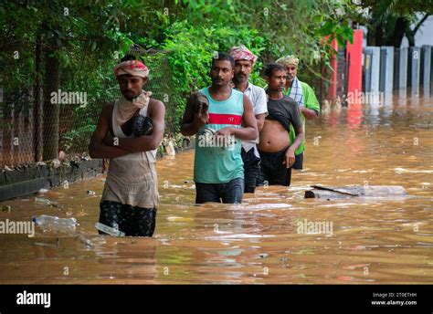 October People Wades Water On A Waterlogged Road After Heavy